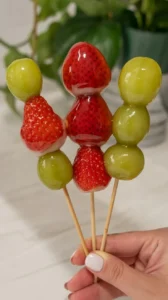 Delicious Tanghulu Chinese candied fruit on a stick.