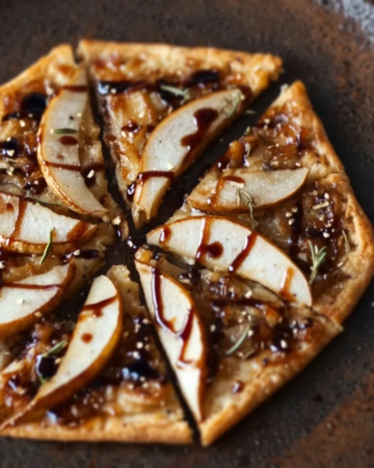 Delicious Balsamic Pear Pizza with fresh pears, cheese, and balsamic glaze