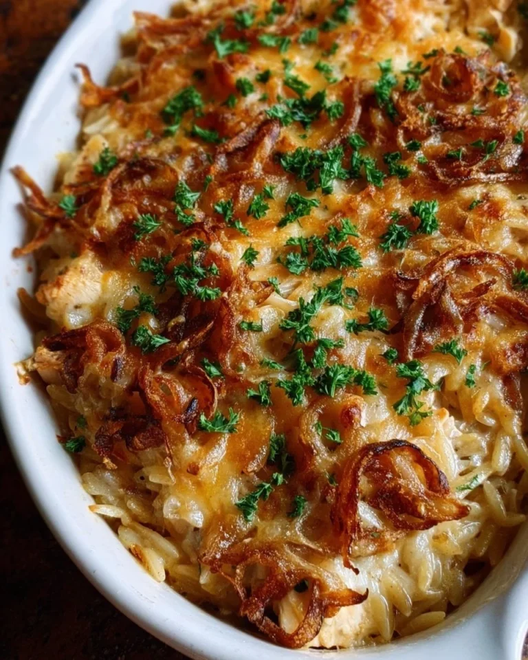 Delicious French Onion Chicken Orzo Casserole with cheese and herbs