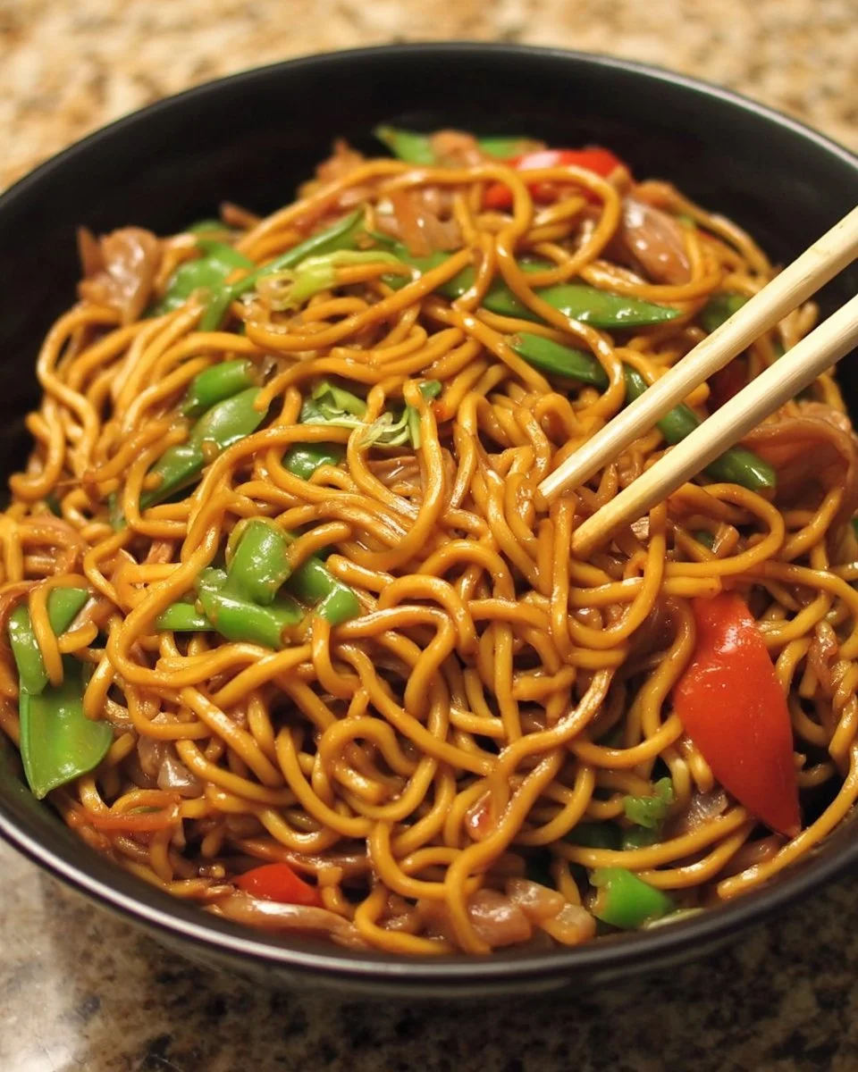 Bowl of Lo Mein noodles with vegetables and sauce