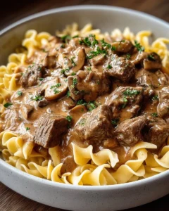 Delicious Old-Fashioned Beef Stroganoff served over egg noodles with mushrooms