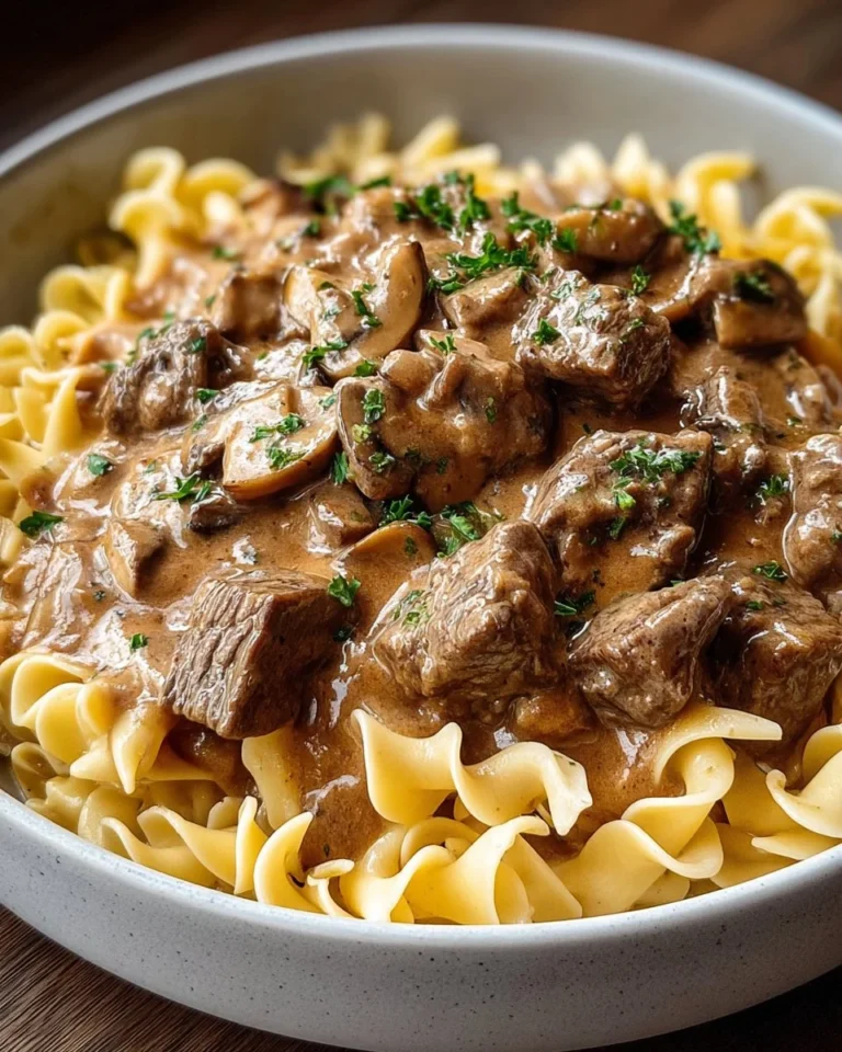 Delicious Old-Fashioned Beef Stroganoff served over egg noodles with mushrooms