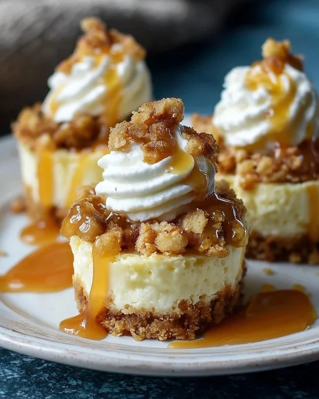 Delicious apple crisp mini cheesecakes featuring creamy layers and apple topping