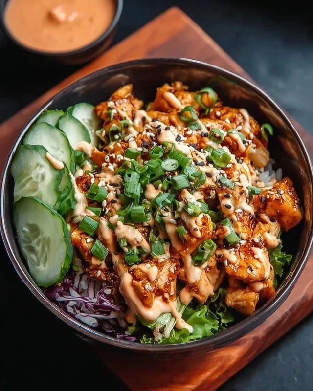 Bang Bang Chicken Bowl with crispy chicken, zesty sauce, and fresh vegetables