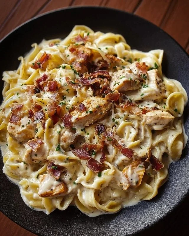 A delicious plate of Chicken Bacon Ranch Pasta garnished with parsley.