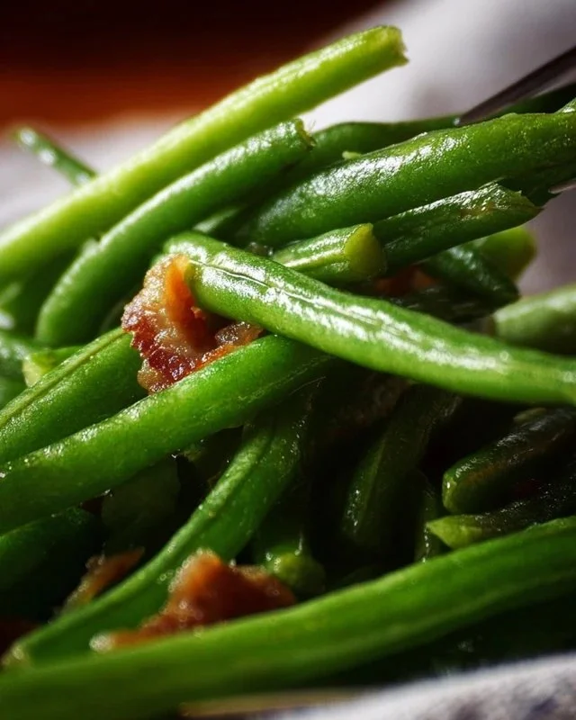 Plate of crack green beans garnished with seasoning