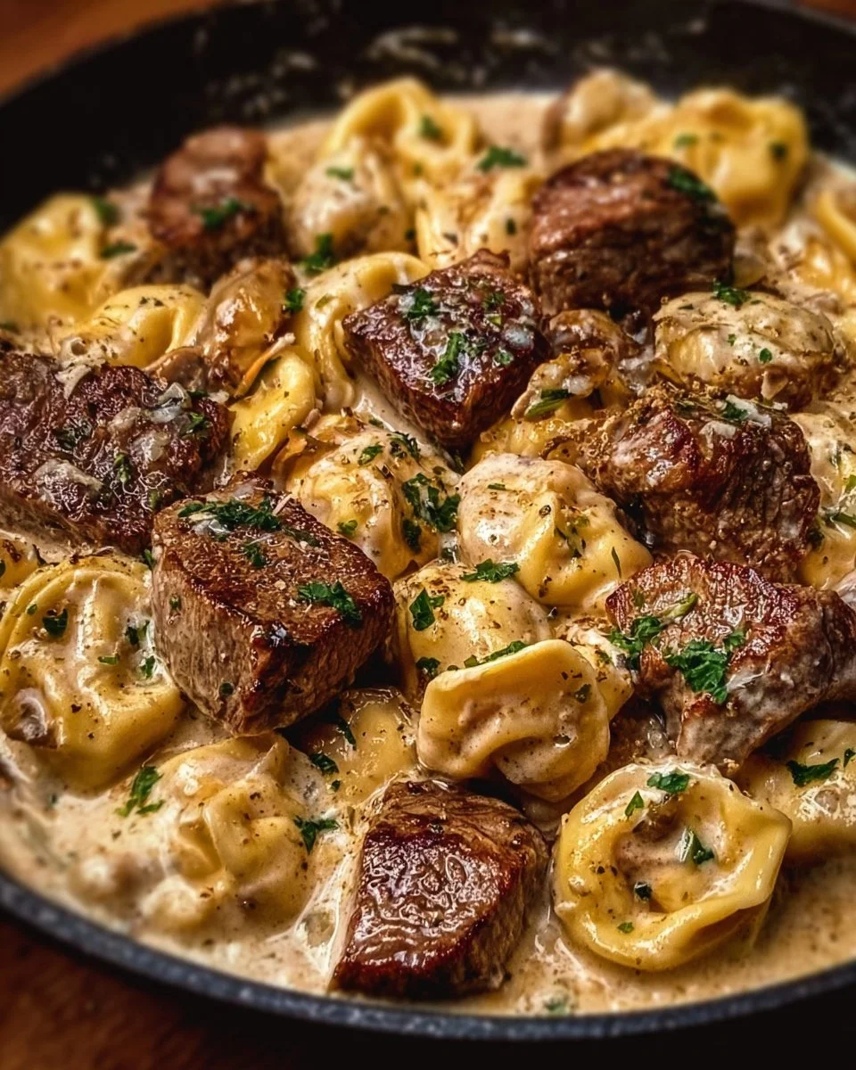 Cracked Garlic Steak Tortellini served in creamy sauce on a plate