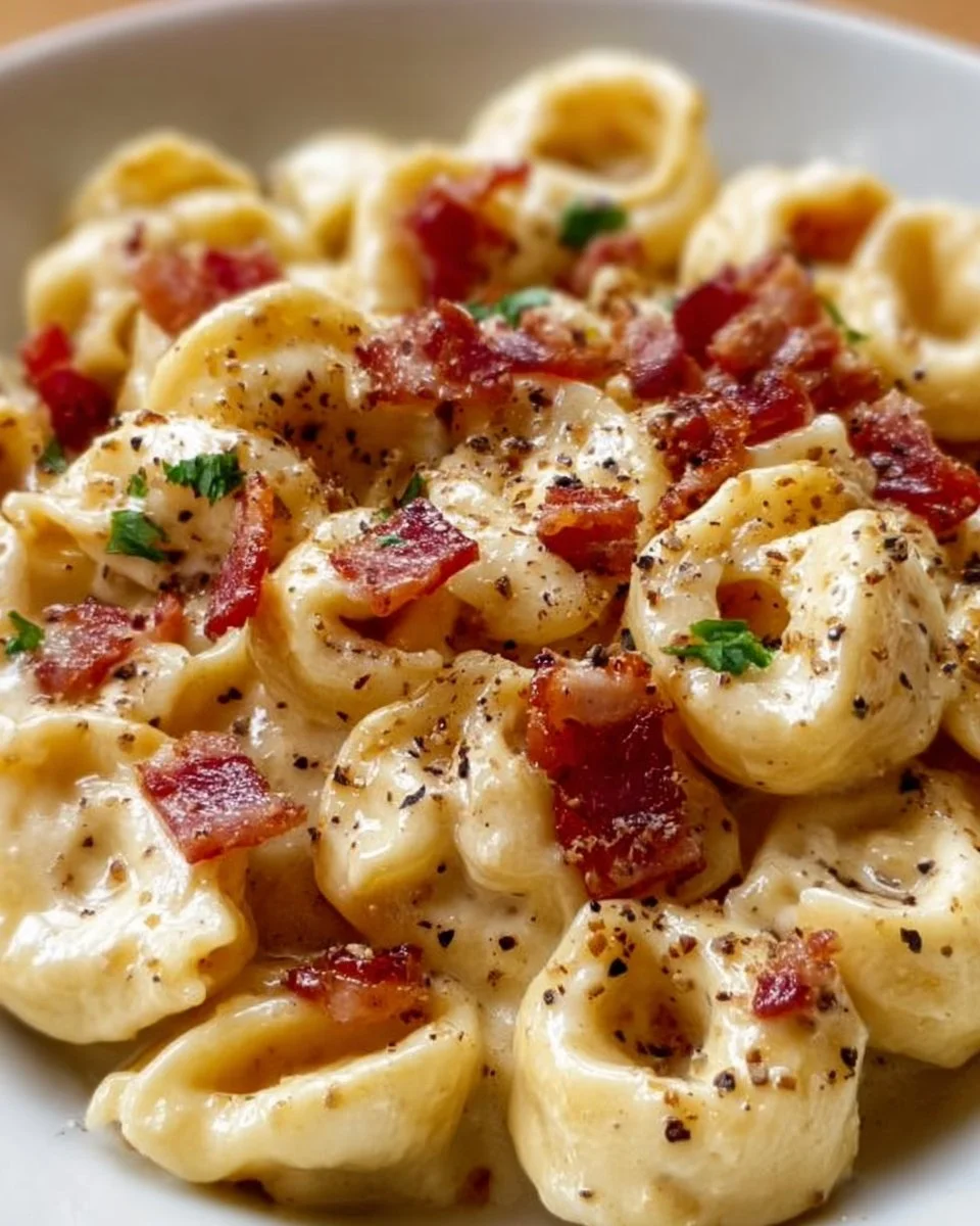 Delicious creamy tortellini carbonara served in a bowl