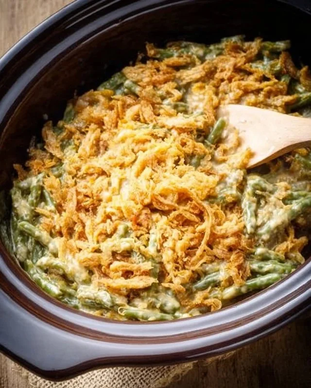 Delicious Crockpot Green Bean Casserole served in a dish, perfect for holidays.