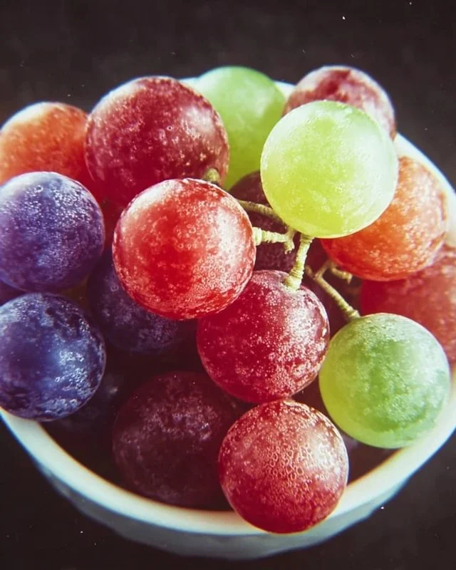 A bowl of vibrant Kool-Aid Grapes ready to enjoy as a refreshing snack