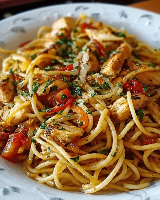 Delicious Monterey Chicken Spaghetti served with herbs and vegetables.