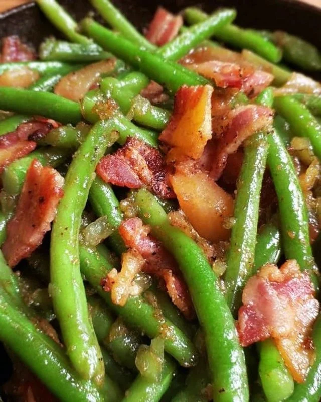 Dish of Southern green beans cooked with bacon for a flavorful side