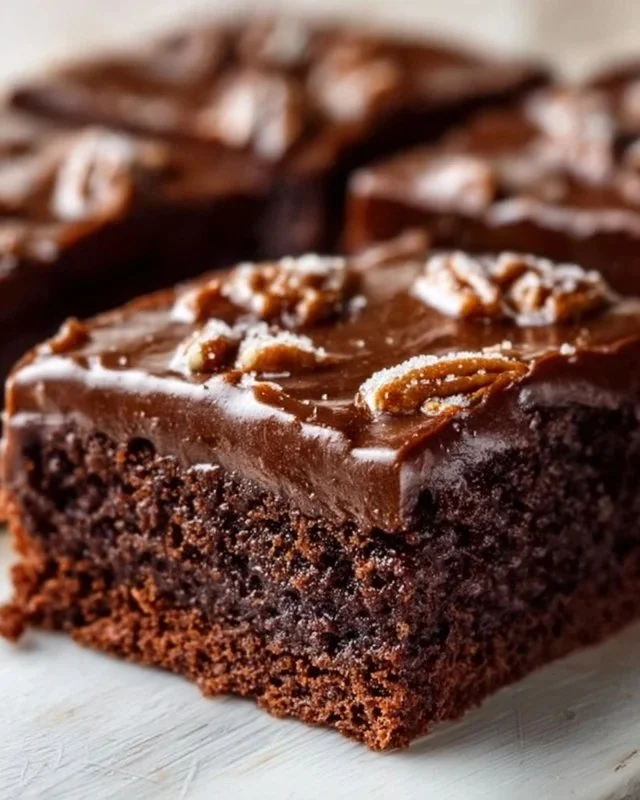 Delicious homemade Texas Sheet Cake topped with chocolate icing.