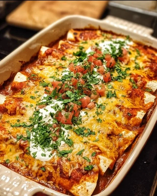 Plate of quick and easy chicken enchiladas topped with cheese and cilantro