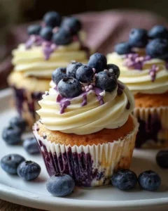 Delicious white chocolate blueberry cupcakes with fresh blueberries