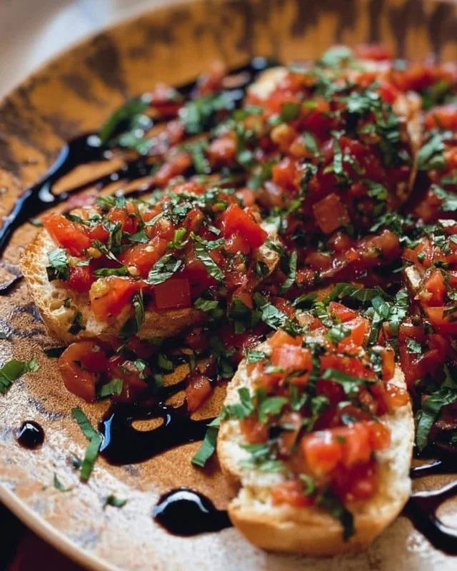 Delicious Bruschetta Dip served with crostini and fresh basil leaves.