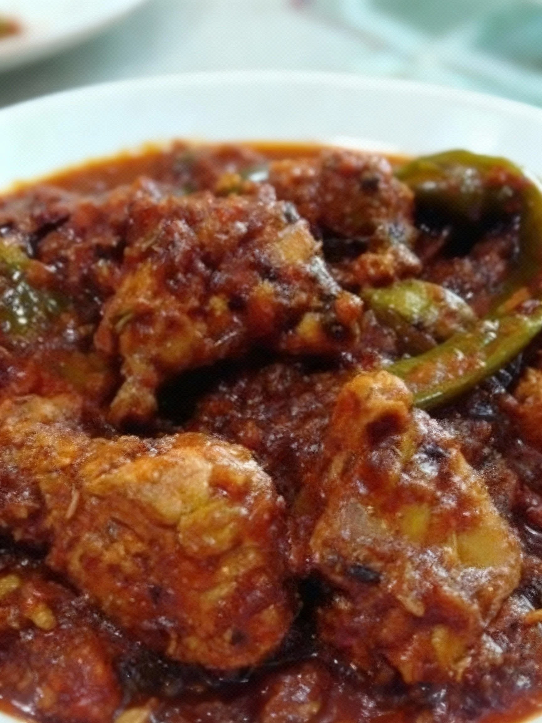 Delicious Bhuna Chicken served in a traditional dish with aromatic spices.
