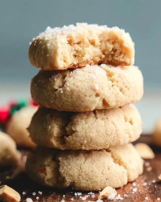 Gluten-free almond flour shortbread cookies stacked on a plate.