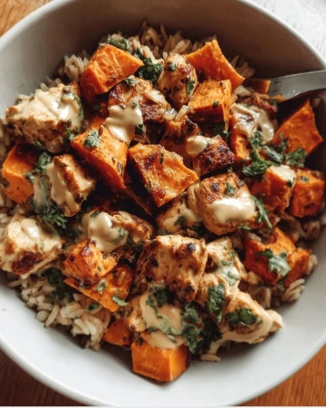 Healthy chicken rice bowl with sweet potatoes and fresh vegetables