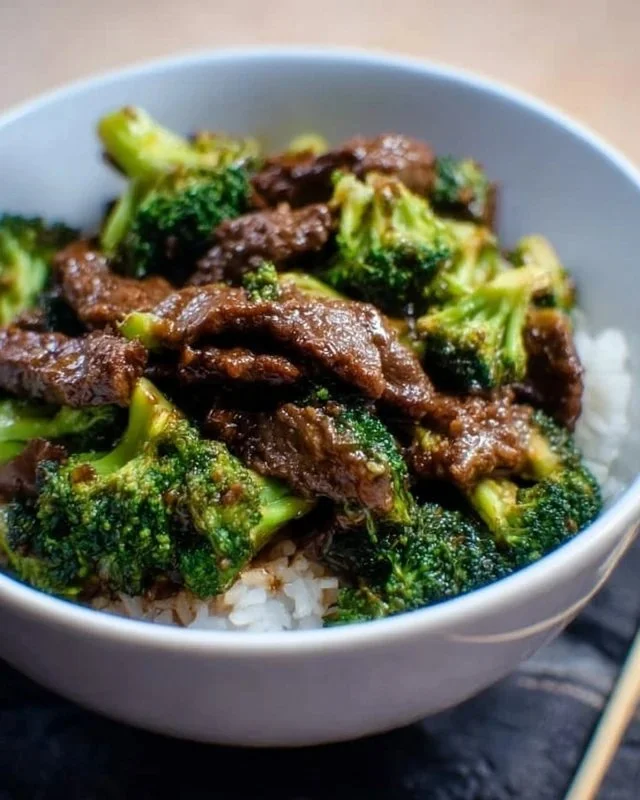 Instant Pot Beef and Broccoli dish served with rice and garnished with sesame seeds