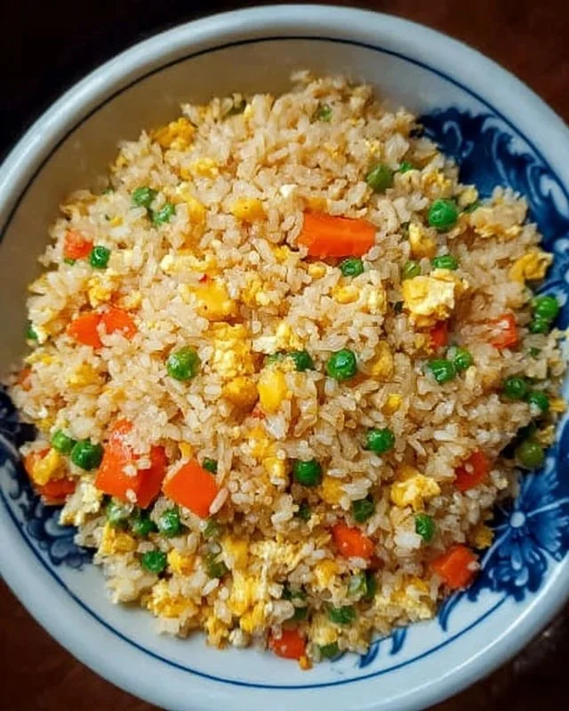 Bowl of Instant Pot fried rice with vegetables and chicken