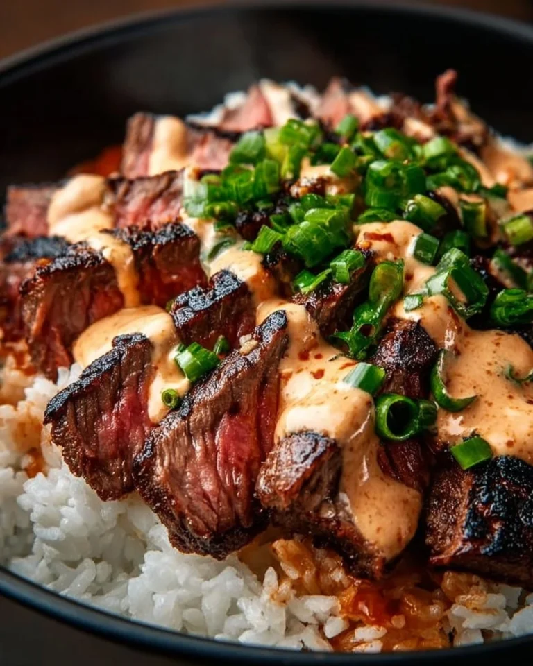 Korean BBQ steak rice bowl with vibrant vegetables and sauce