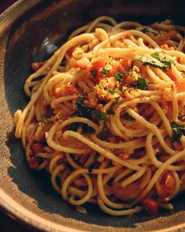 Plate of Midnight Pasta with fresh herbs and cheese