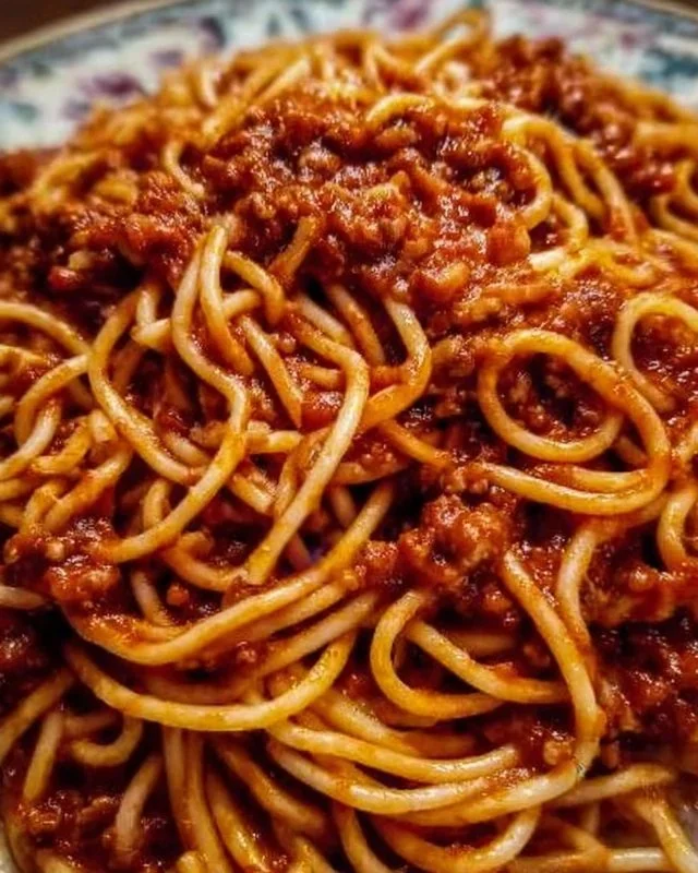 Delicious plate of Old School Spaghetti with rich sauce and herbs
