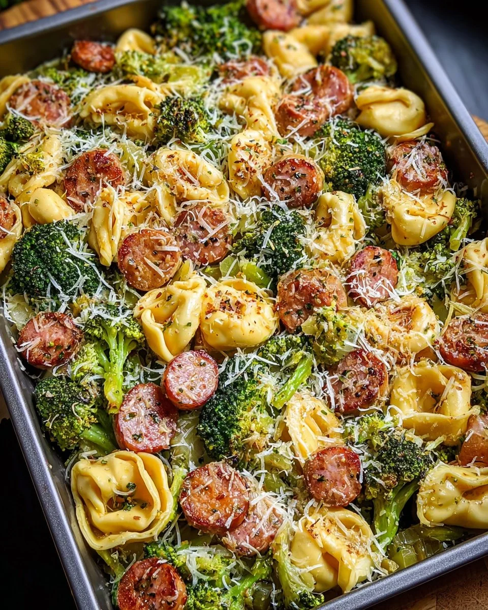 Sheet Pan Broccoli Tortellini Bake with cheese and vegetables on a baking sheet