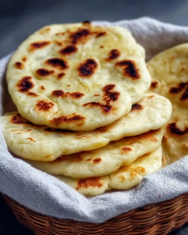Homemade sourdough naan bread made with sourdough discard.