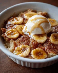 Delicious Southern banana cobbler served in a dish with fresh bananas