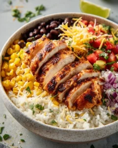 Chicken and black bean burrito bowls with vibrant toppings and ingredients