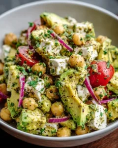 Chickpea Feta Avocado Salad with fresh ingredients in a colorful bowl