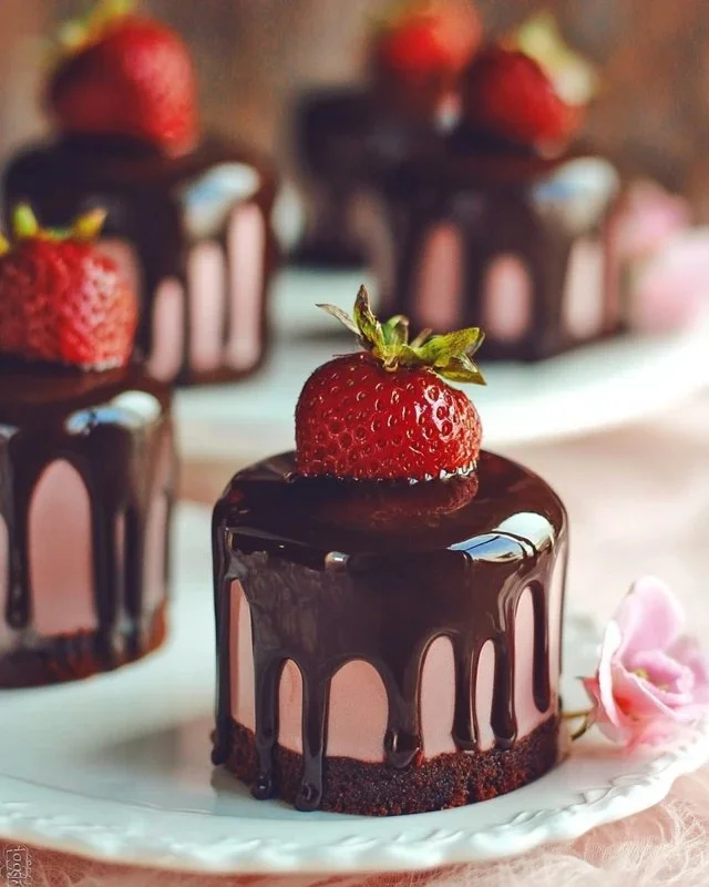Chocolate-Covered Strawberry Mini Cakes displayed on a decorated platter
