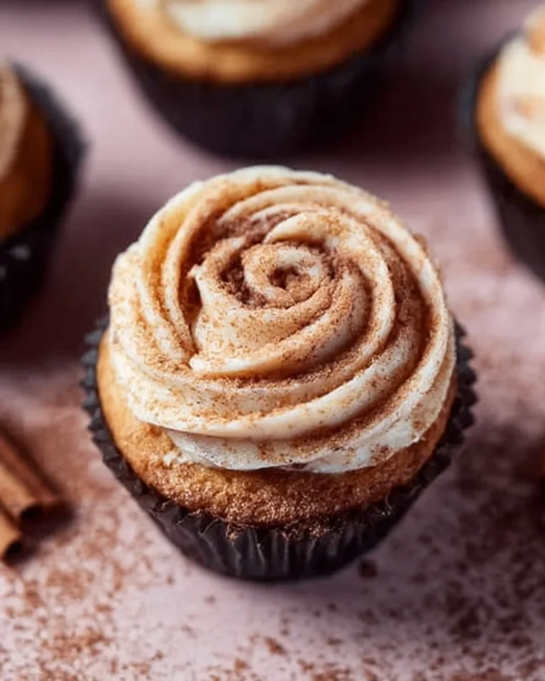 Delicious cinnamon roll cupcakes topped with cream cheese frosting