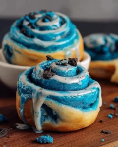 Delicious blue swirl cookie monster cinnamon rolls fresh out of the oven.