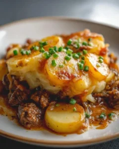 Crockpot hamburger potato casserole dish with cheese and potatoes