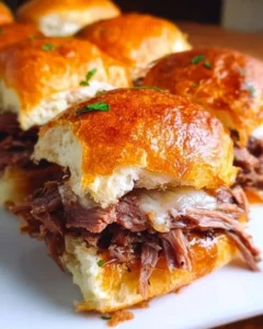 Delicious French Dip Sliders with roast beef and au jus dip