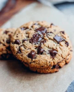 Giant chewy keto chocolate chip cookies on a cooling rack