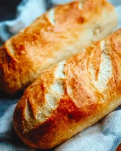 Golden and crispy French bread loaf fresh out of the oven.