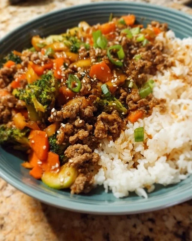 Ground turkey teriyaki stir fry with colorful vegetables in a bowl.