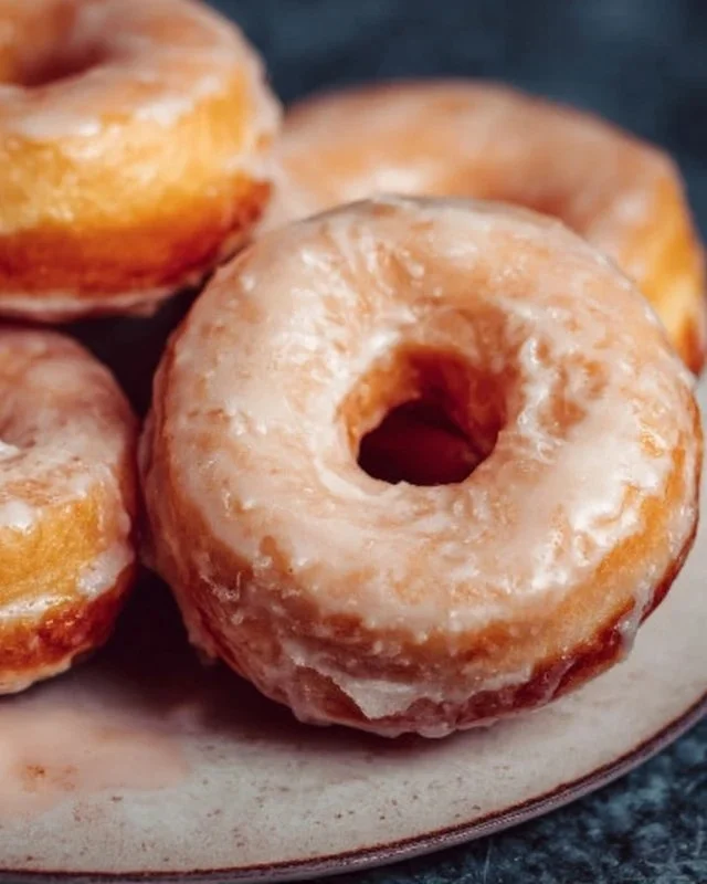 Delicious homemade glazed donuts on a cooling rack