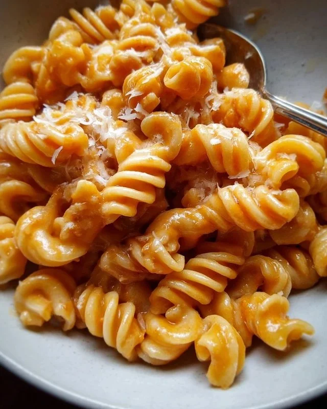 Bowl of Pasta Alla Zozzona, also known as Messy Pasta, served with sauce and herbs