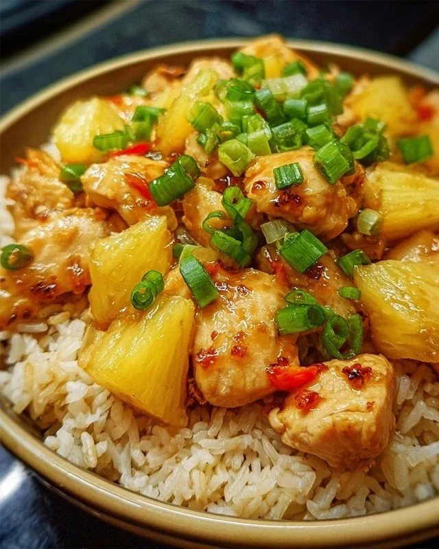 Delicious Pineapple Chicken served with rice in a colorful dish