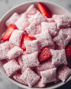 Delicious Quick Strawberry Shortcake Puppy Chow in a bowl