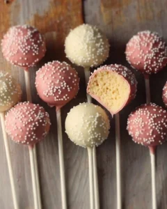 Homemade Starbucks copycat birthday cake pops decorated with colorful sprinkles.