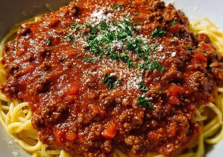 Bowl of traditional Italian spaghetti sauce with herbs and tomatoes