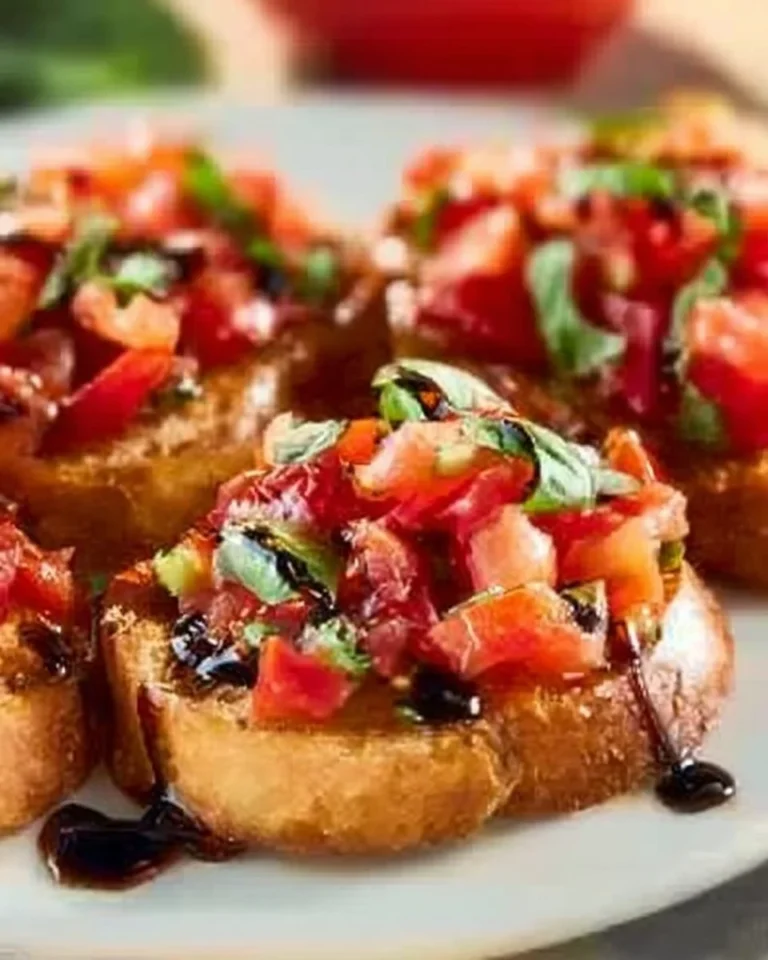 Delicious authentic Italian Bruschetta topped with fresh tomatoes and basil