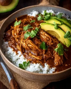 Delicious Chicken Mole served on a plate with herbs and spices