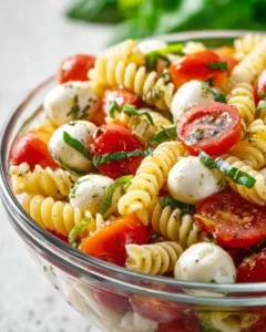 Creamy Caprese Pasta Salad with fresh tomatoes, mozzarella, and basil